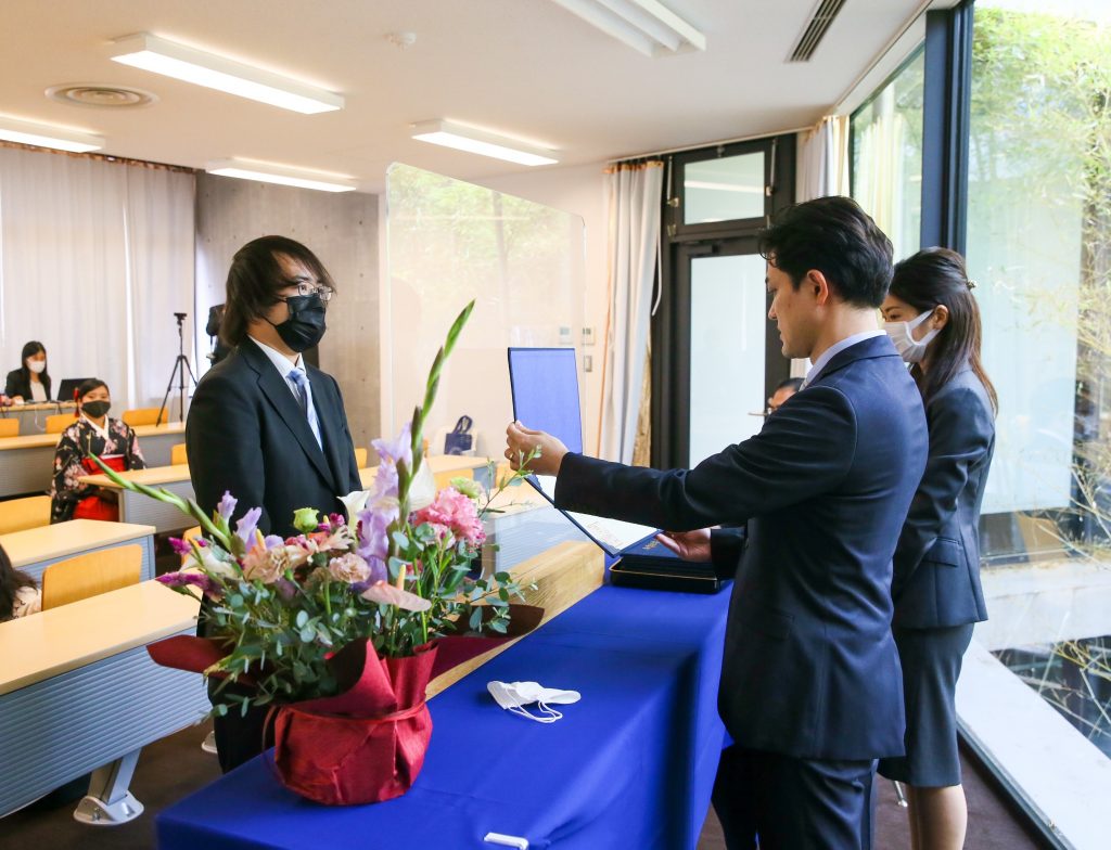 International student from Hong Kong receiving his diploma