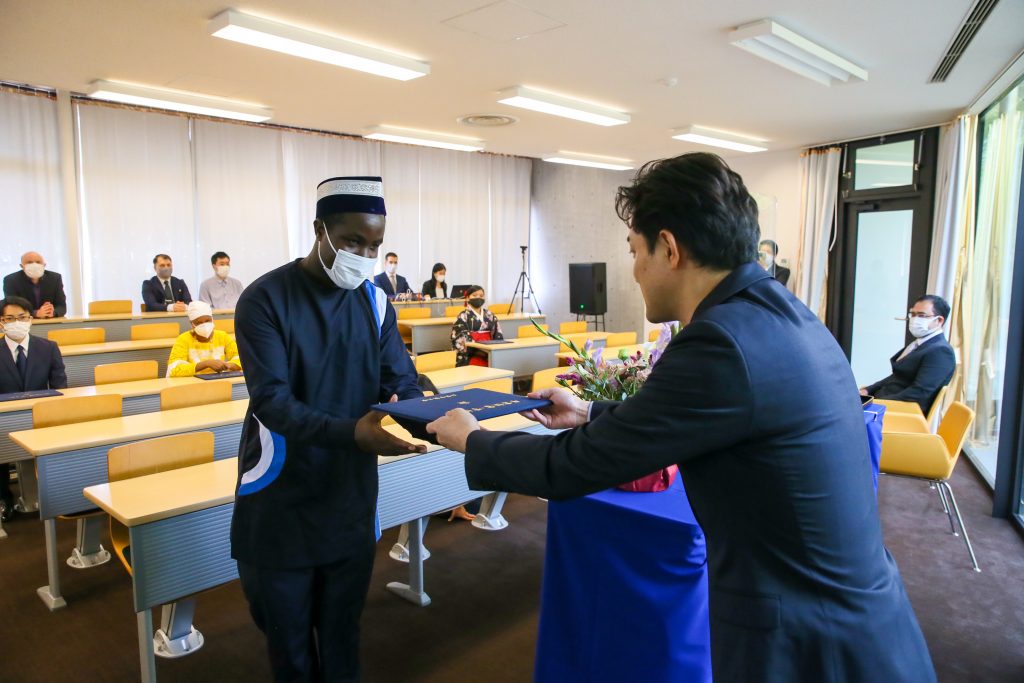 International student from Uganda receiving his diploma