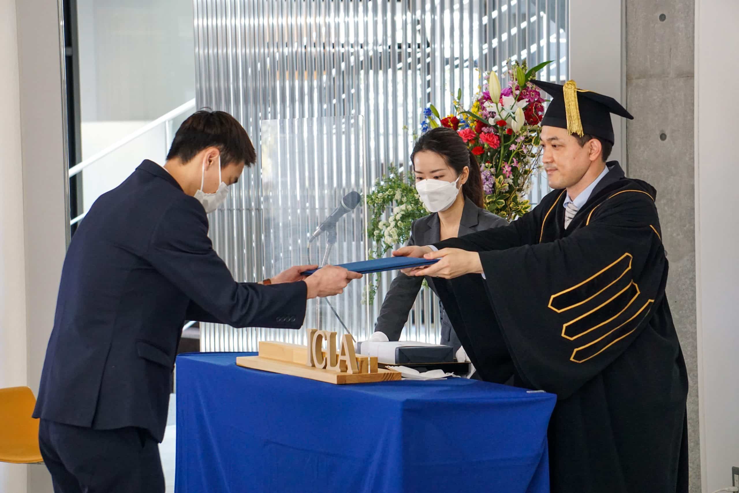 Valedictorian receives his certificate