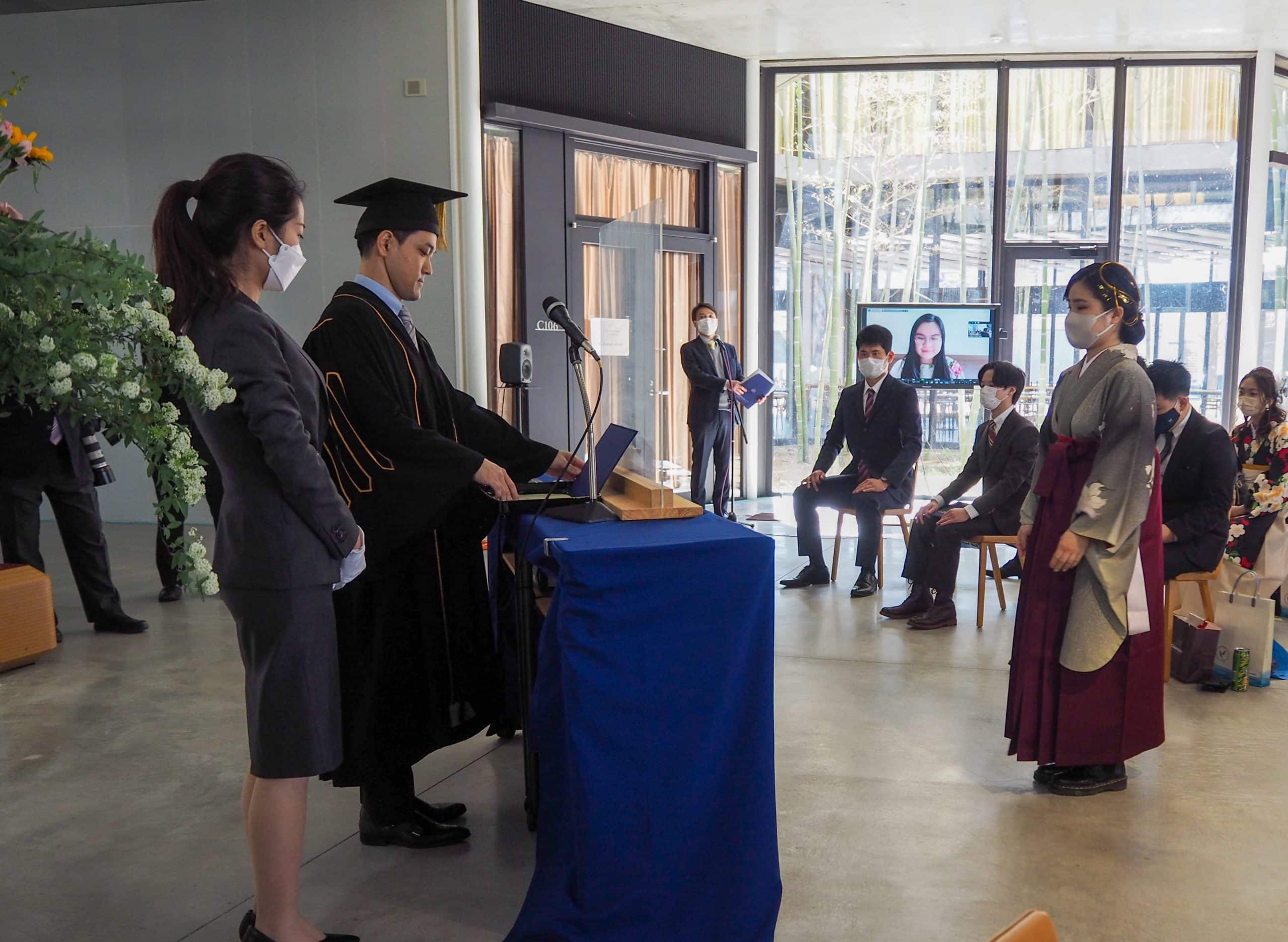 Female iCLA student receives her diploma