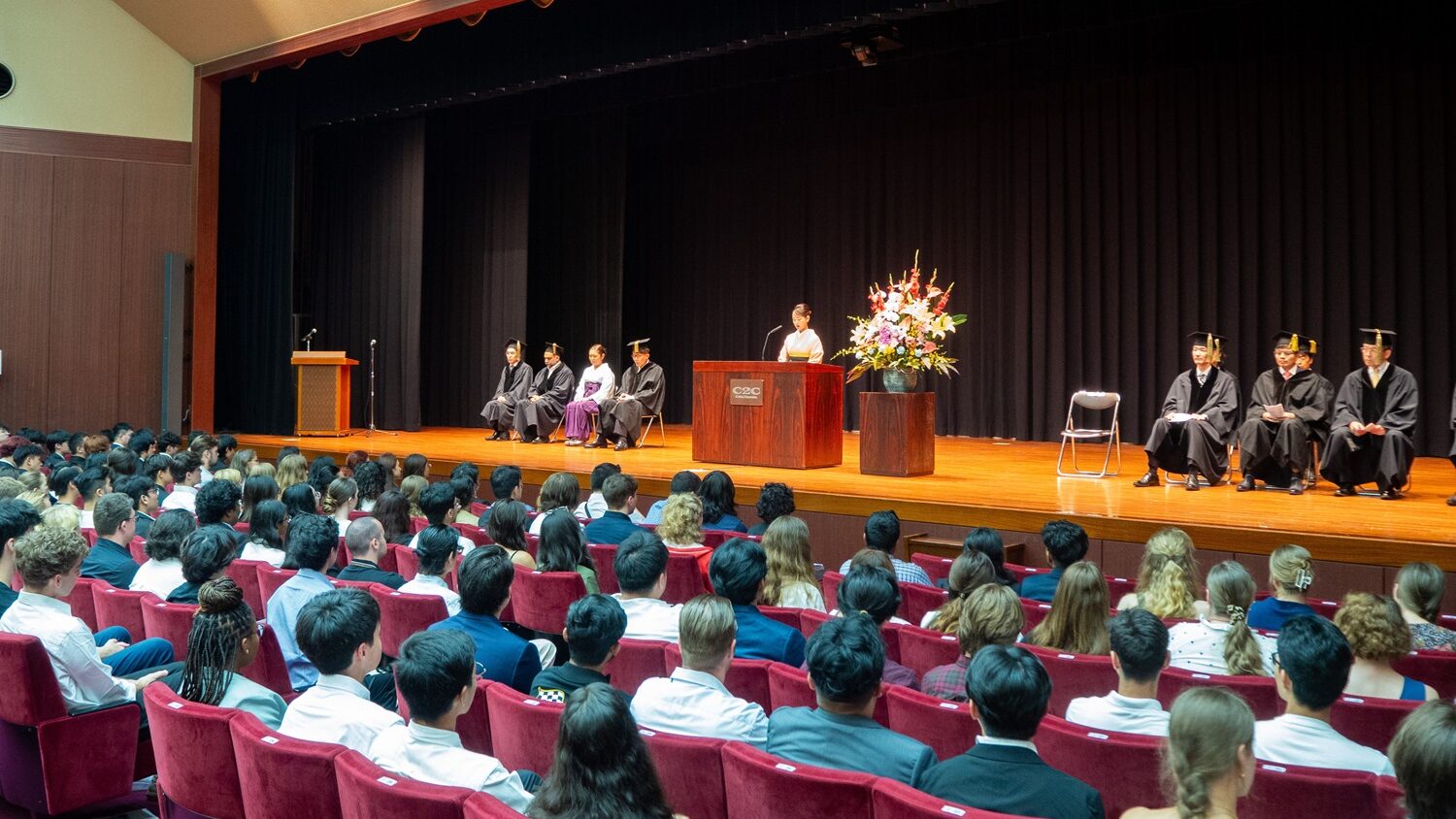 Yamanashi Gakuin University's President Takako Aoyama gives her welcome speech to new students at the Memorial Hall for the Fall 2024 Entrance Ceremony. 