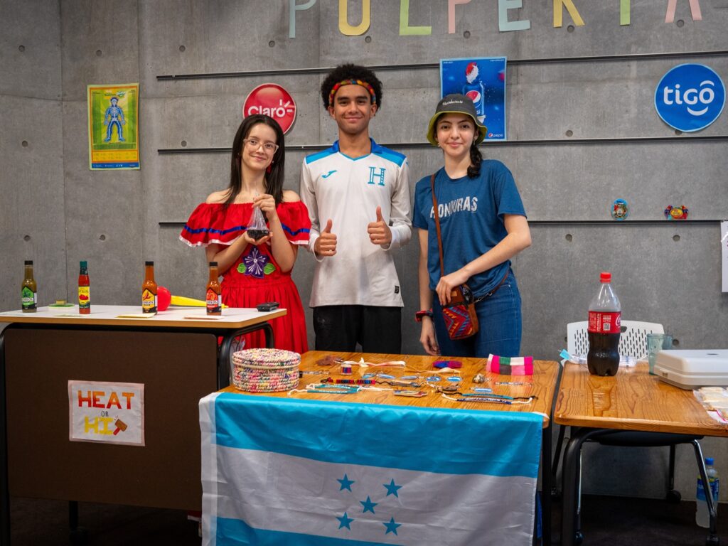 Honduran iCLA Students set up a colorful booth decorated with Honduran icons.