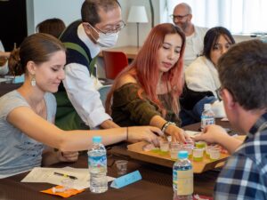 iCLA students take cups of Japanese tea distributed by a certified instructor of the Japanese Tea Instructors Association.