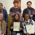 iCLA students who joined the Yamanashi International Student Speech Contest and their supporters pose for the camera. The students who won award are holding up their certificates.