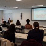 iCLA students sit in a lecture room in Kofu City Hall to learn about disaster preparation.